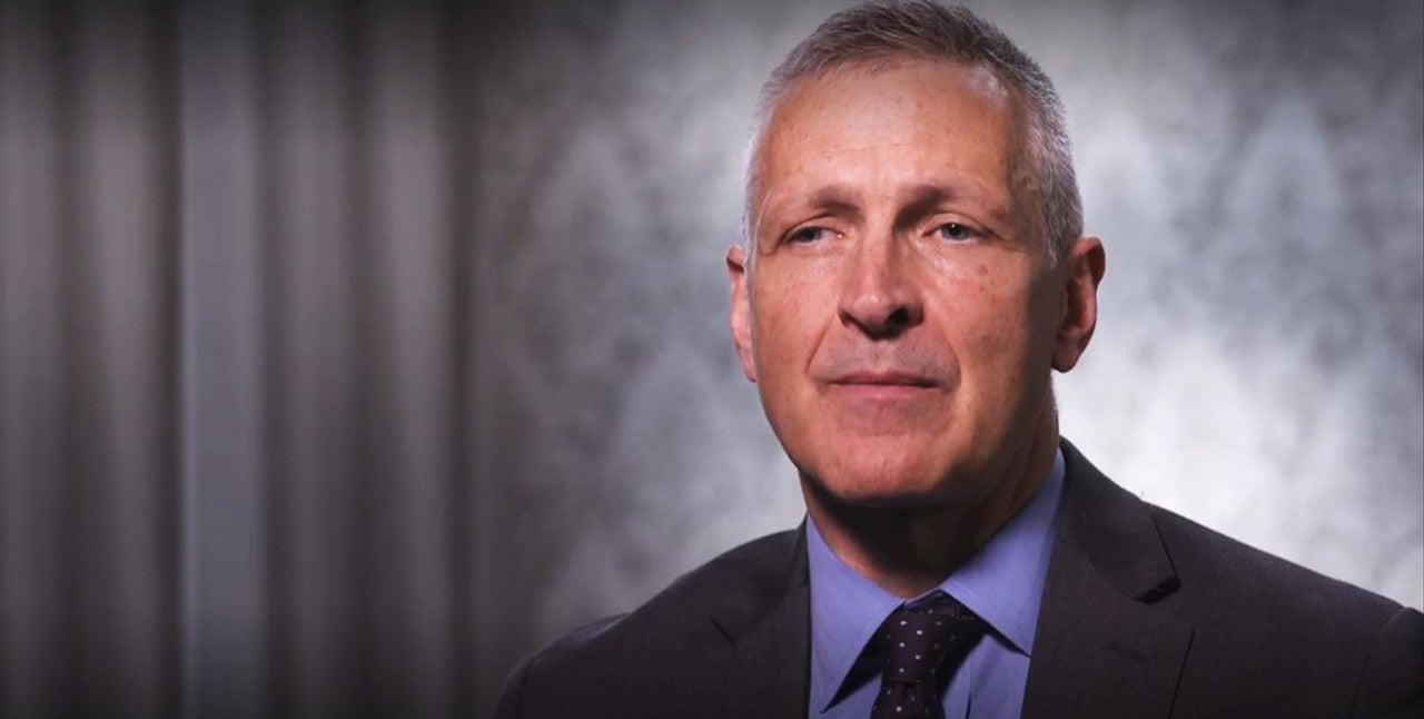 Still from Video. Dr. Johnson looking directly into the camera talking. 