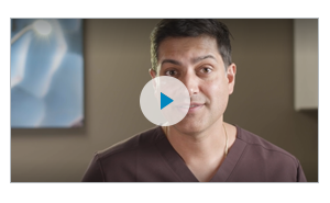 Still from the video, Dr. Mehan looking into the camera discussing his approach.