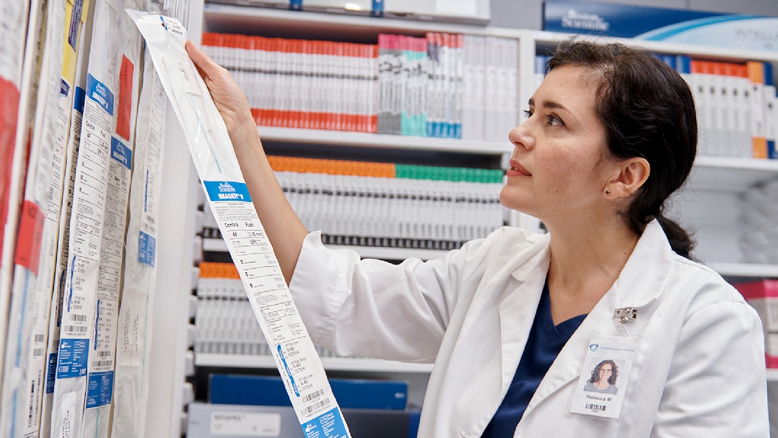 Healthcare provider reading from long list of literature.