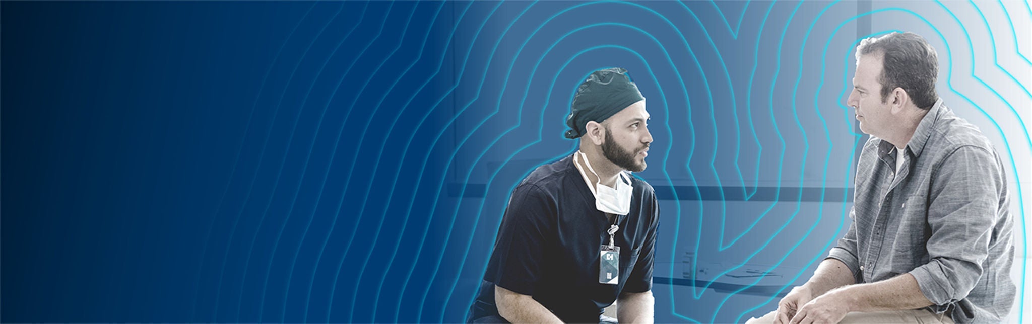 Healthcare provider in discussion with male patient.