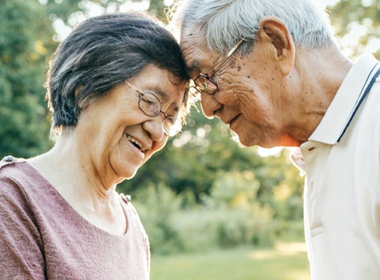 Happy older couple outside