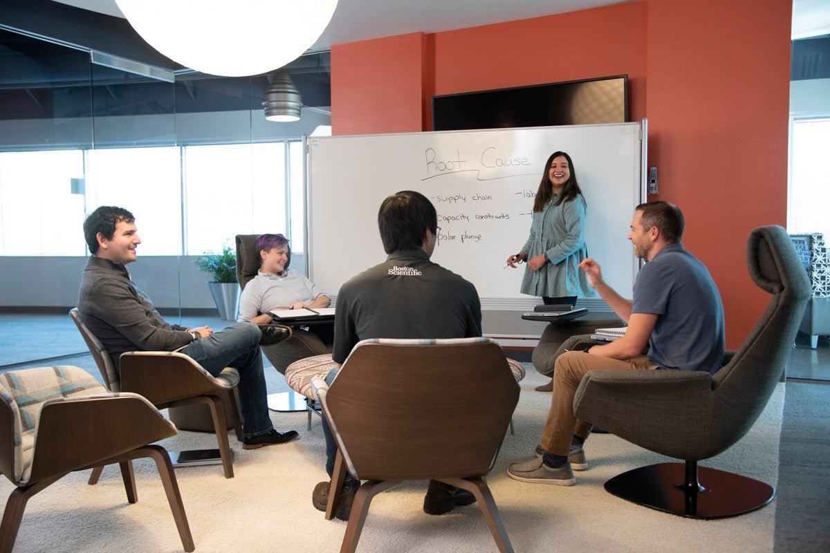 Group of colleagues actively collaborating during a meeting