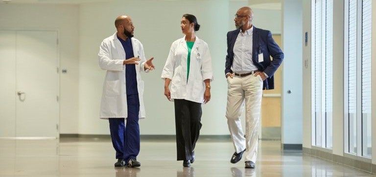 Physicians speaking in EDUCARE corridor