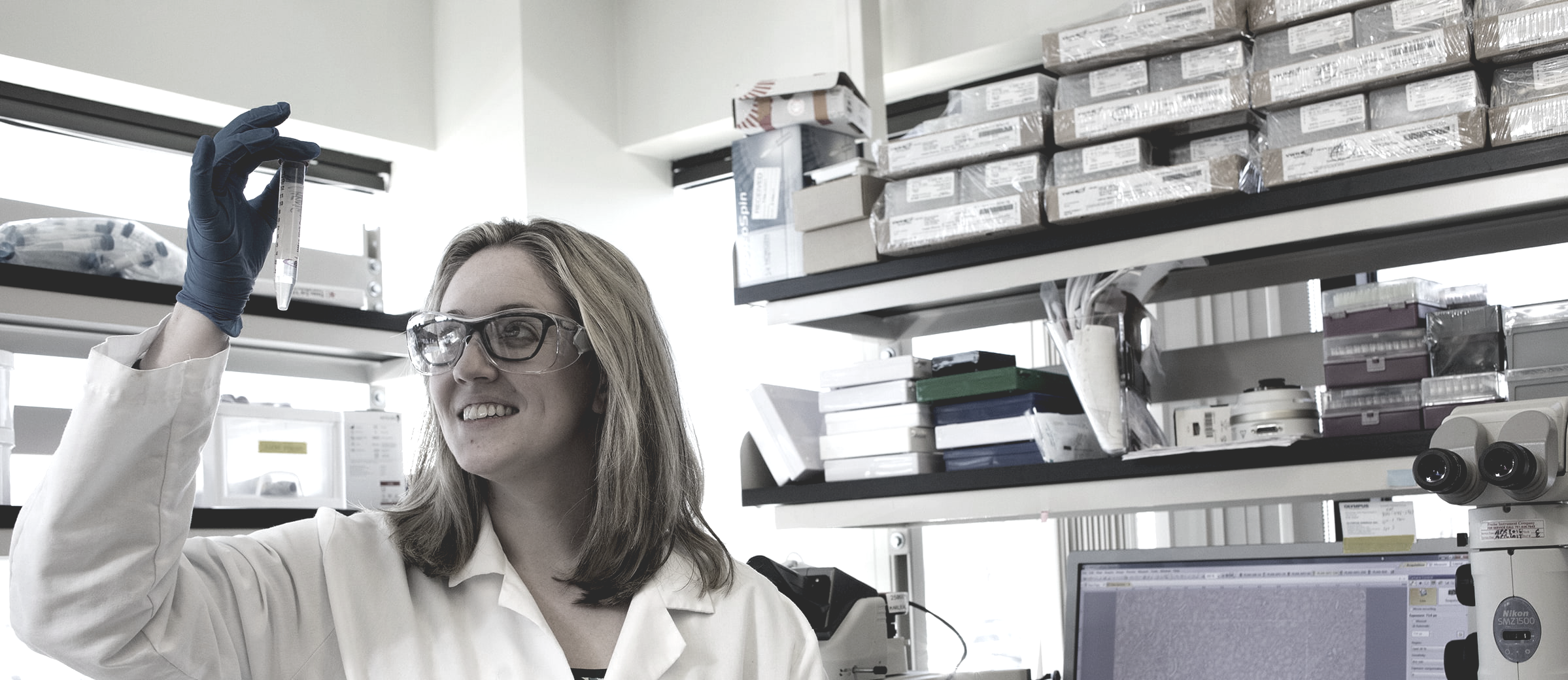 female lab technicians looking test tube