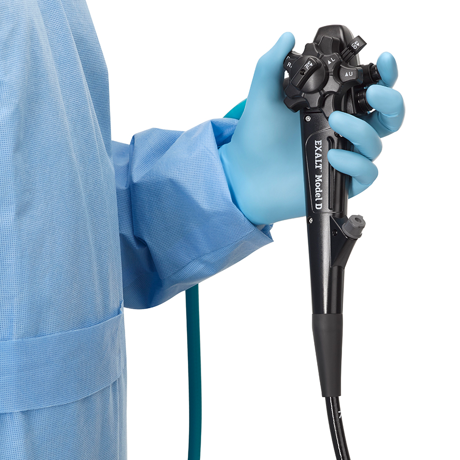 Surgeon holding EXALT Single-use Duodenoscope