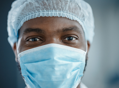 Healthcare professional with scrub hat and surgical mask