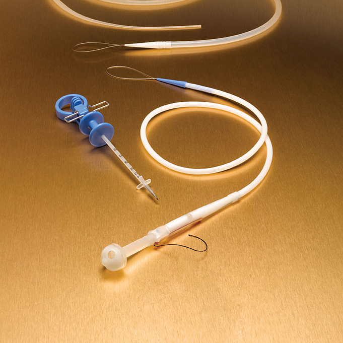 The undeployed Initial Placement One Step Button is pictured here with the Percutaneous Stoma Measuring device which is included in the kit.
