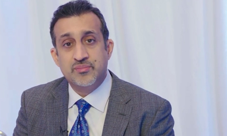 Portfolio image of Dr. Ravish Sachar, MD wearing a suit and tie.