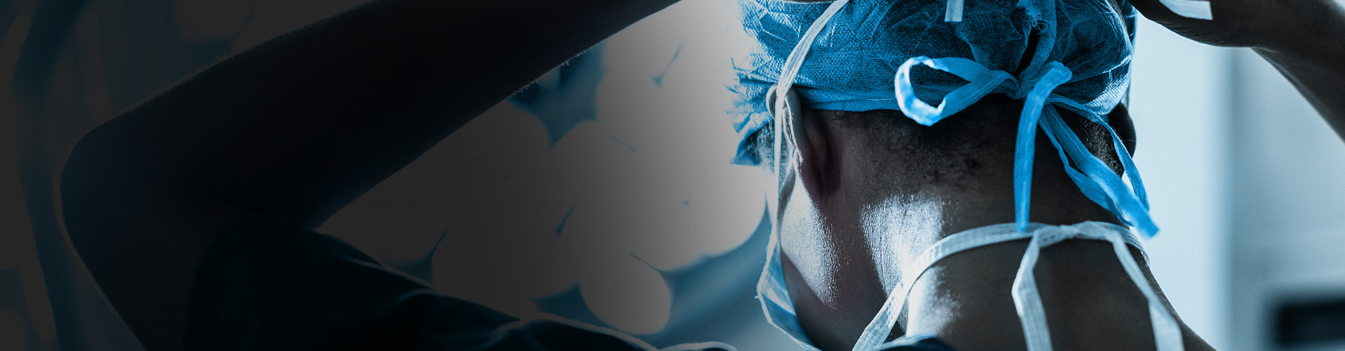 View of medical professional's back of head wearing a surgical mask
