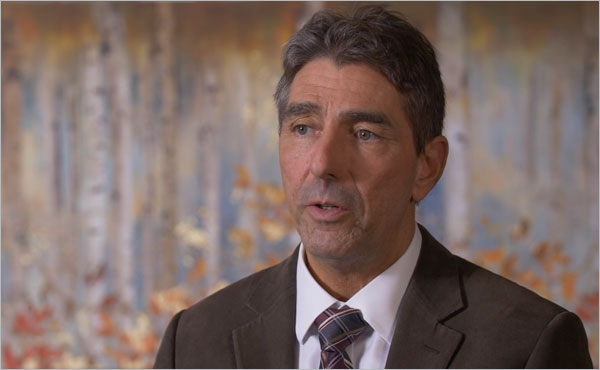 Still from video. Dr. Fagundes sitting in an interview setting discussing prostate cancer and SpaceOAR. 