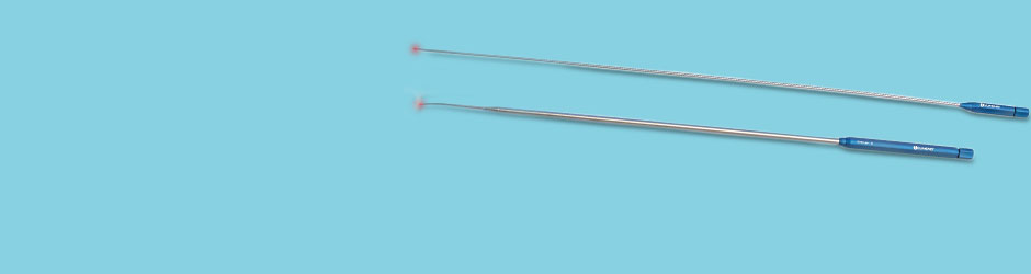 Two CO2 laser fiber sitting parallel of each other with laser light illuminated on the end. 