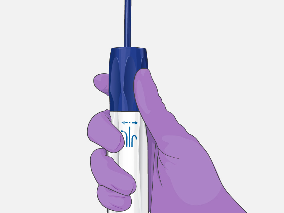 Hand with surgical glove holding the VersaCross Steerable Access Solution with tactile feedback and a rotating dial.