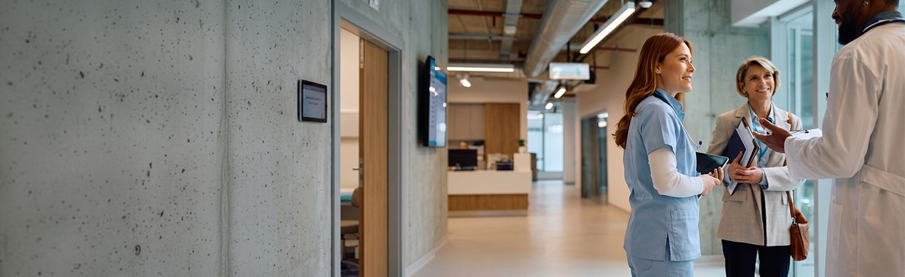 Healthcare professionals discussing with each other in a modern medical facility