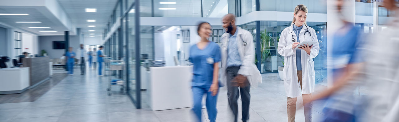 Healthcare professionals working in a busy hospital environment
