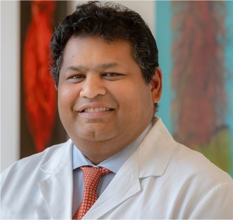 Dr. Muthusamy, gastroenterologist in white lab coat