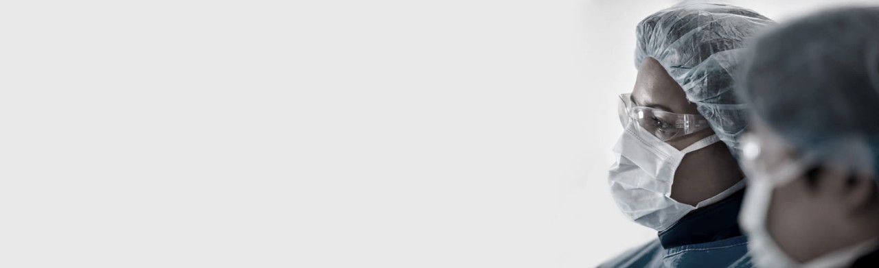 Medical specialist looks to the left off screen