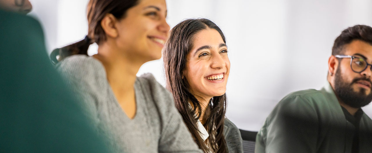 Diverse employees collaborating during a team meeting, reflecting Boston Scientific's inclusive workplace culture.