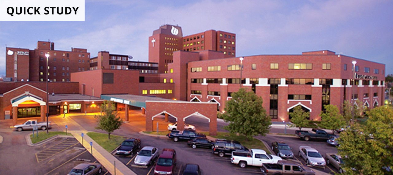 Quick Study background photo of brick hospital