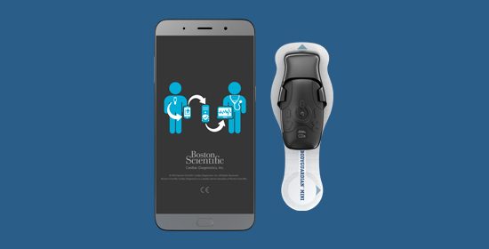BodyGuardian Mini device in adhesive strip and mobile phone with telemetry diagram on blue background 