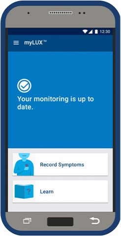 Smartphone screen with myLUX app and words "Your monitoring is up to date."