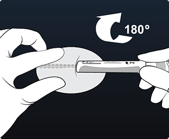 Hands twisting LUX-Dx Insertion Tool 180 degrees to create a pocket.