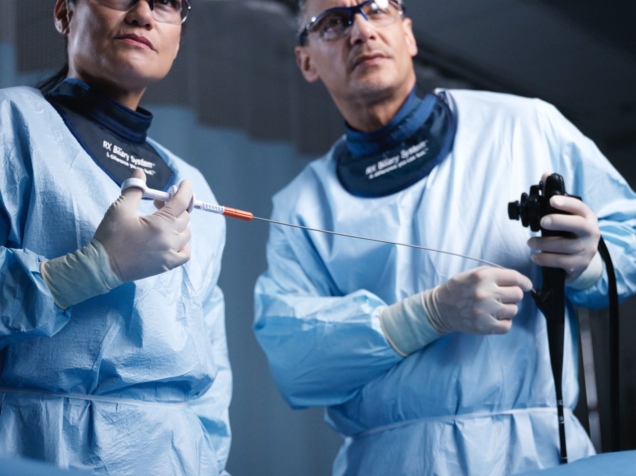 Health care providers holding medical devices.