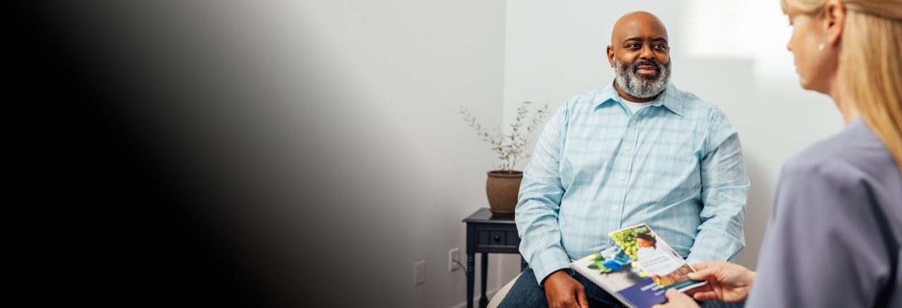 patient sitting with doctor