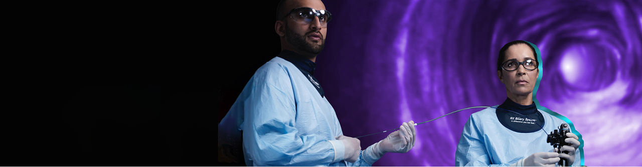 two health care professionals in lab coat holding medical device image.