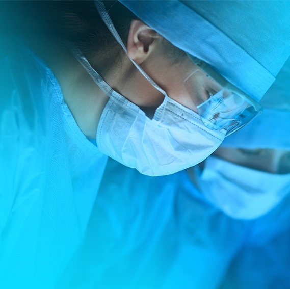 image of physicians looking down wearing blue mask