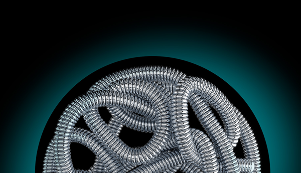Embold soft coil device wrapped in a circle on black background with greenhue