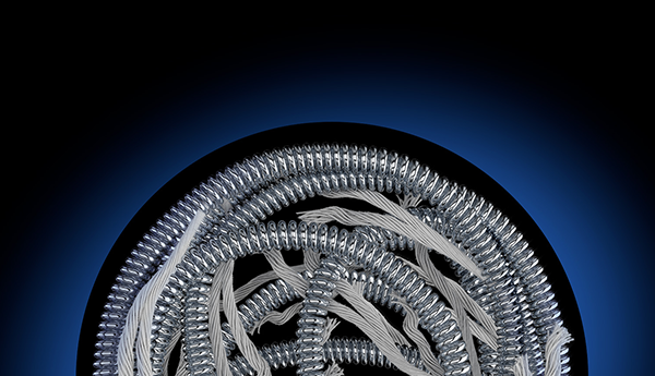 Embold fibered coil device wrapped in a circle on black background with blue hue