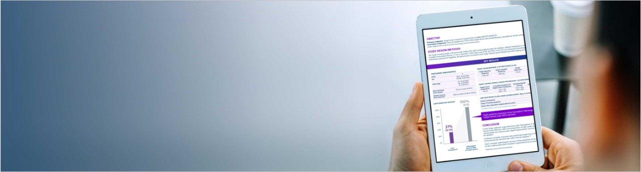 Person reading tablet with TheraSphere Y-90 Glass Microspheres information.