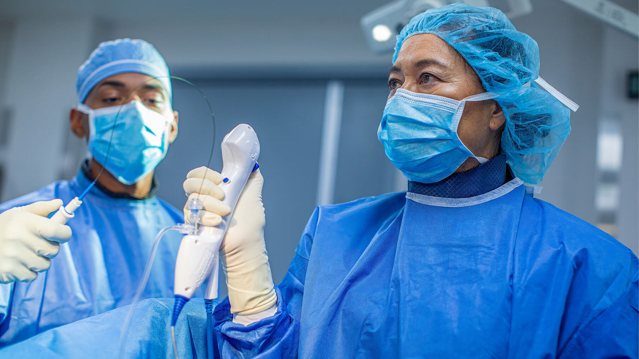 Surgeons using the Boston Scientific LithoVue single-use digital ureteroscope in an operating room 