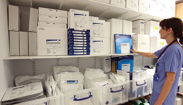 Healthcare provider in a supply room.
