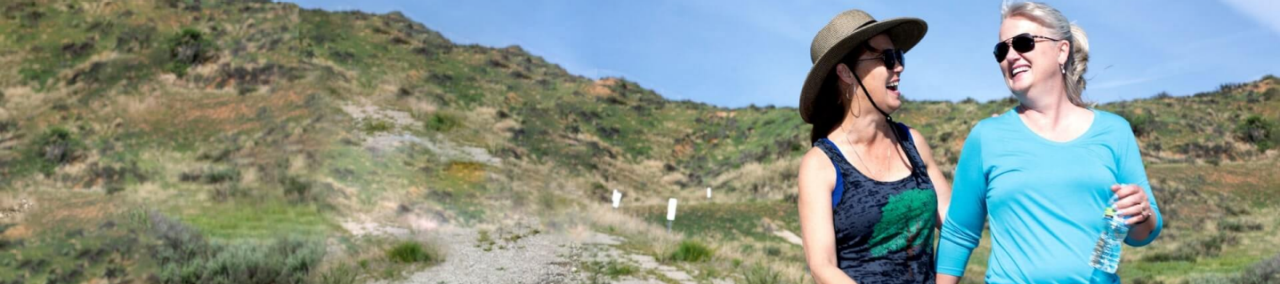 Two people walking outdoors.