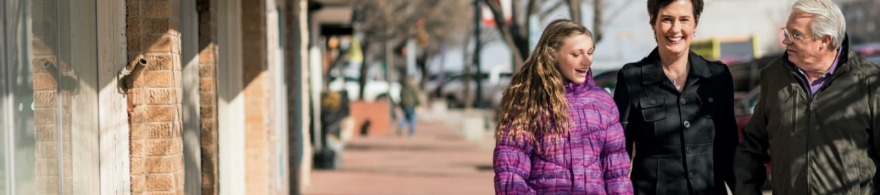Patient ambassador Karen and family outdoors.