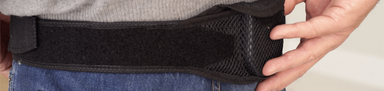 close-up of SCS charging belt on man's waist.