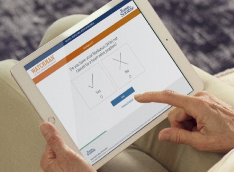 Patient looking at WATCHMAN resources on tablet
