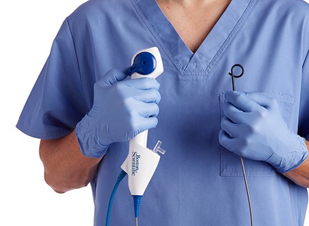 Doctor holding a Lithovue ureteroscope