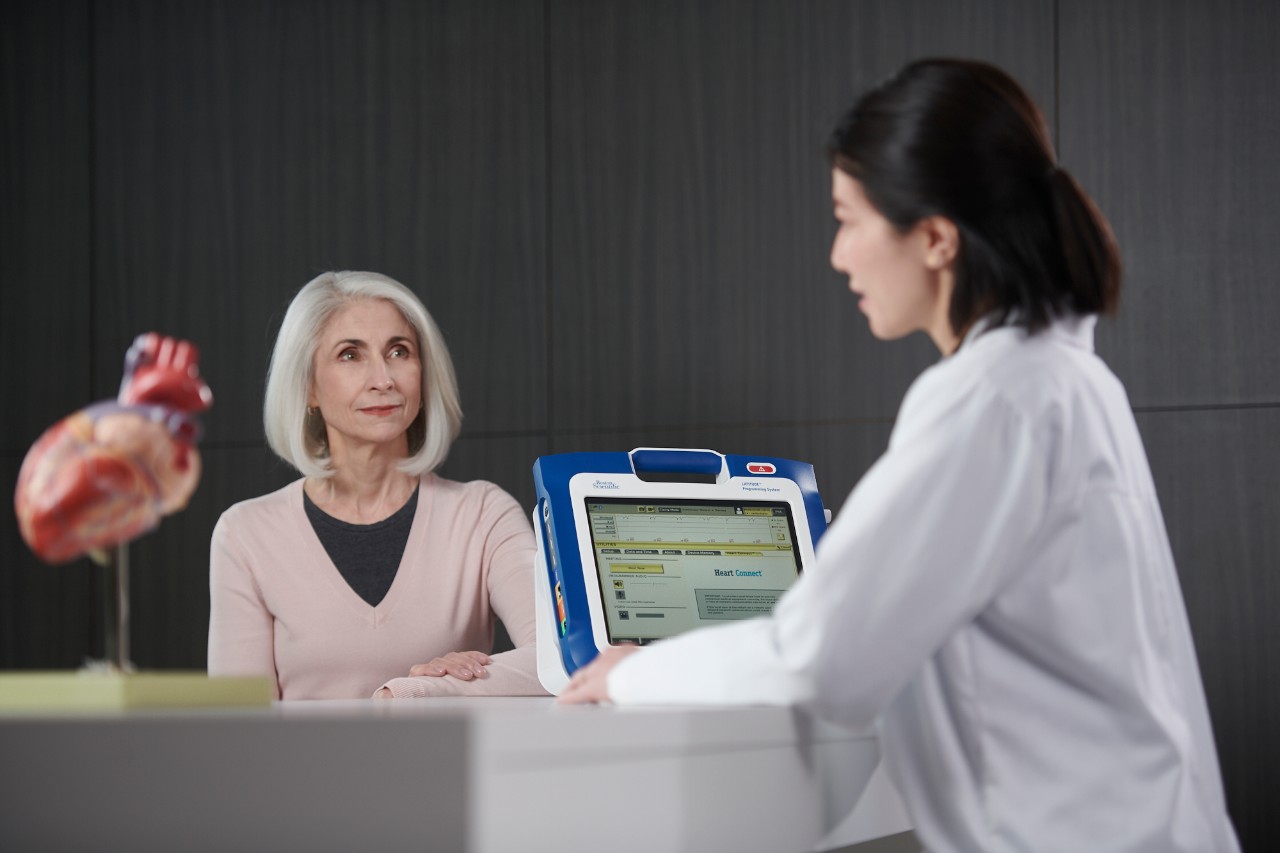 Patient and clinician sharing programmer screen information with a remote user via the Heart Connect System.