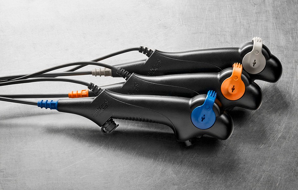 Three EXALT Model B Single-Use Bronchoscopes with blue, orange and gray accents.
